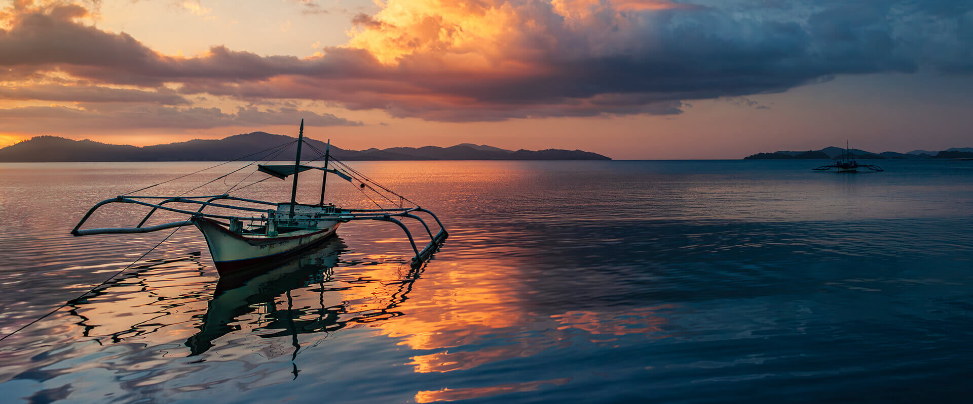 Serene Seascape with Islands and Bangkas after Sunset